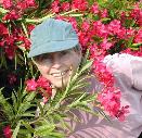 Anne in rhododendrons on way to beach